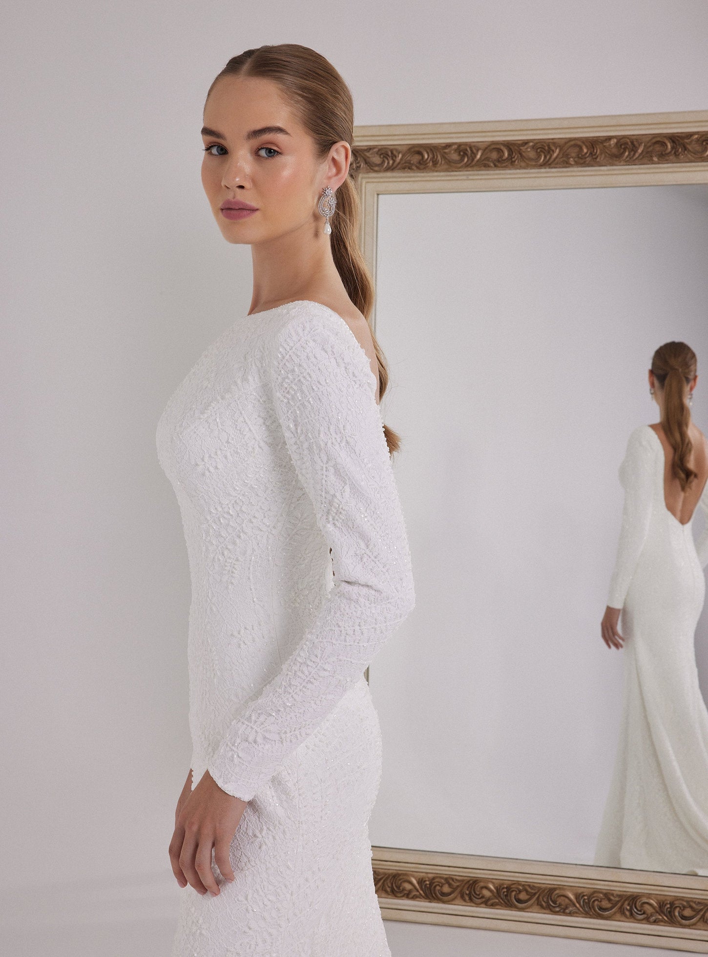 Long Sleeve Mermaid Wedding Dress with a Deep Back Decollete