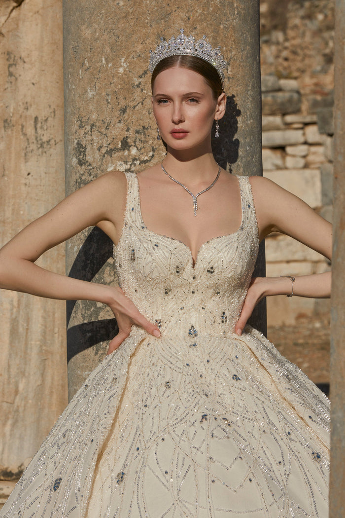 Glisten in Glamour: Cream-Colored Bridal Dress with Dazzling Embellishments