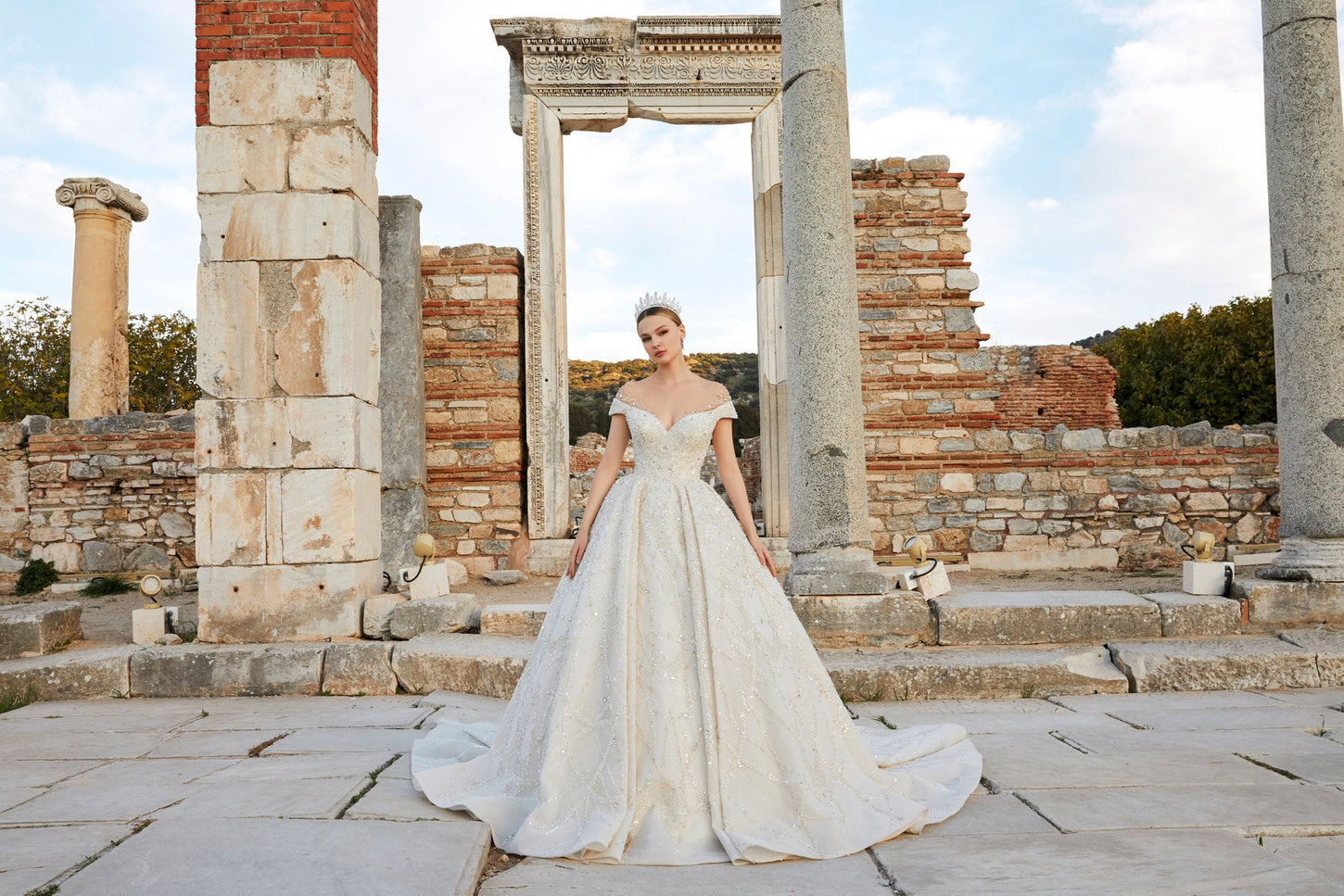 Artistry in Ivory: Off-the-Shoulder Bridal Ensemble with Timeless Charm