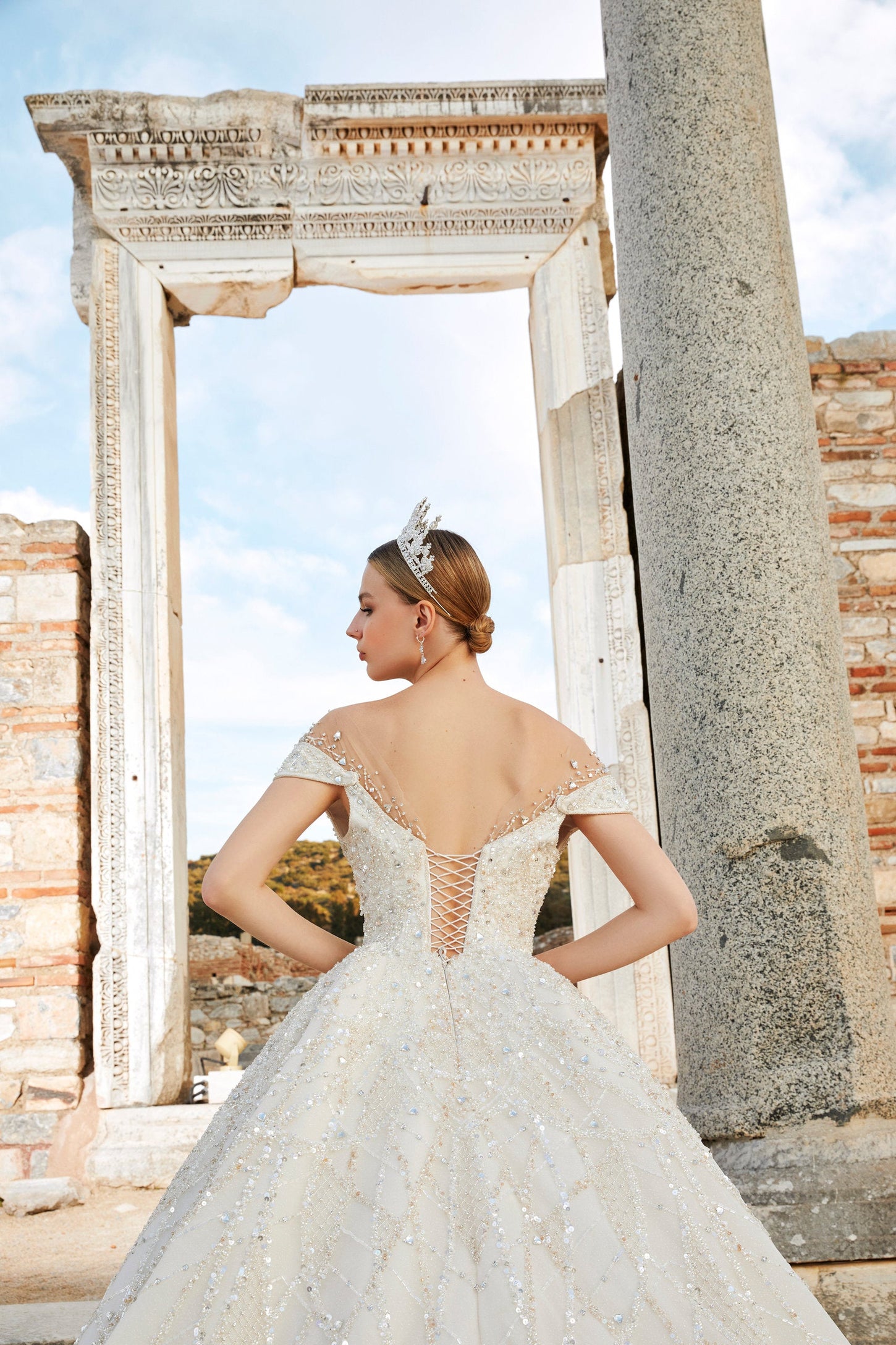 Artistry in Ivory: Off-the-Shoulder Bridal Ensemble with Timeless Charm