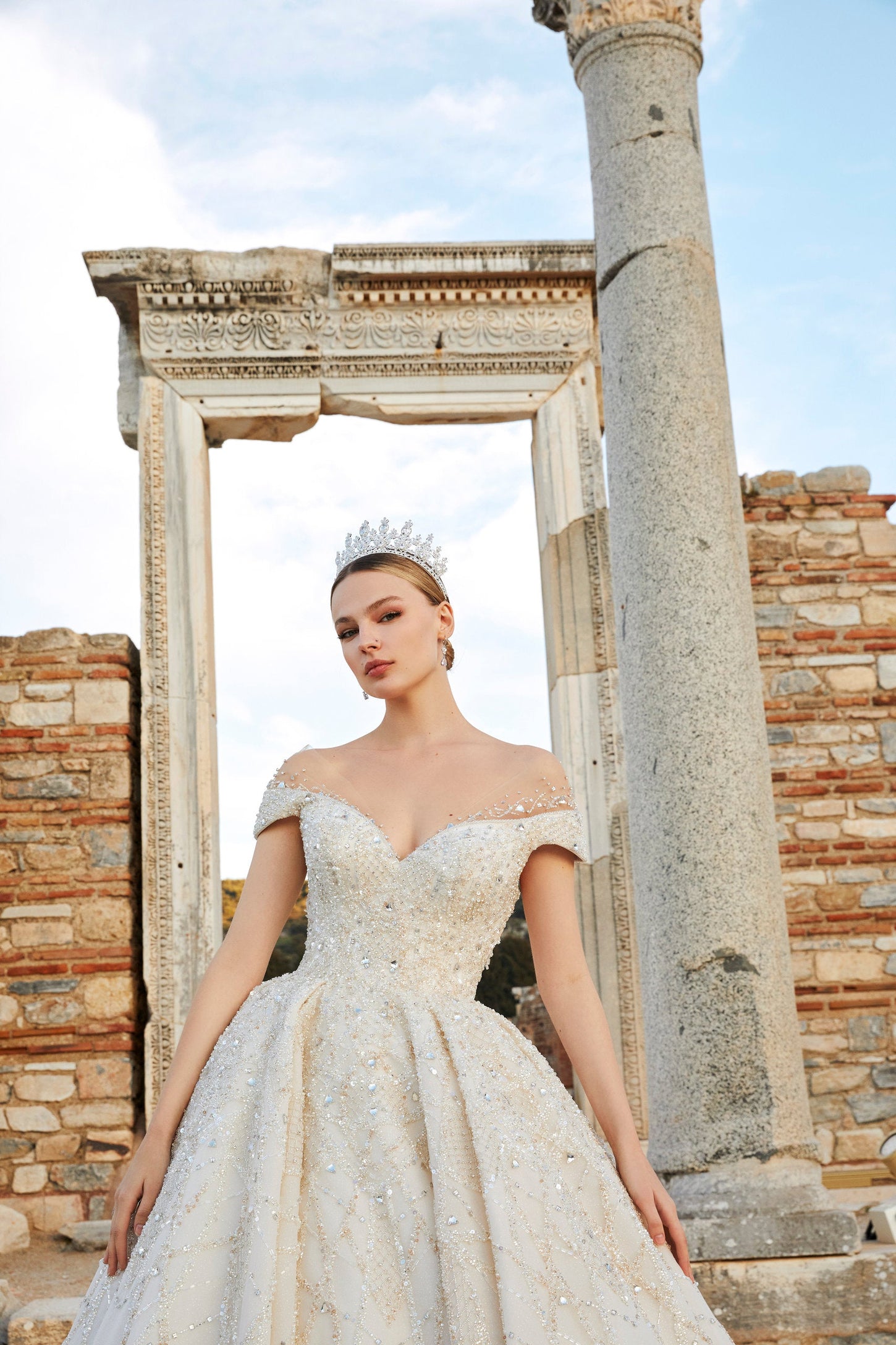 Artistry in Ivory: Off-the-Shoulder Bridal Ensemble with Timeless Charm