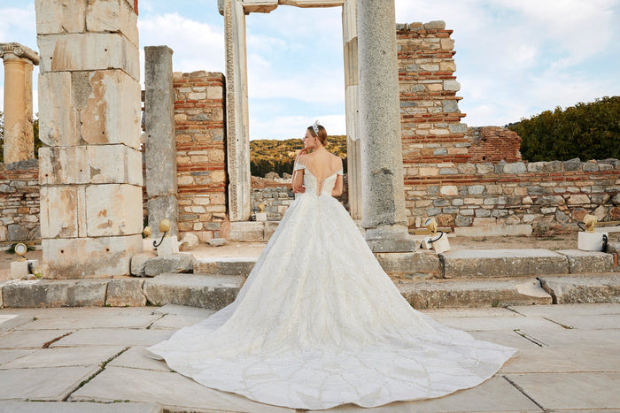 Artistry in Ivory: Off-the-Shoulder Bridal Ensemble with Timeless Charm