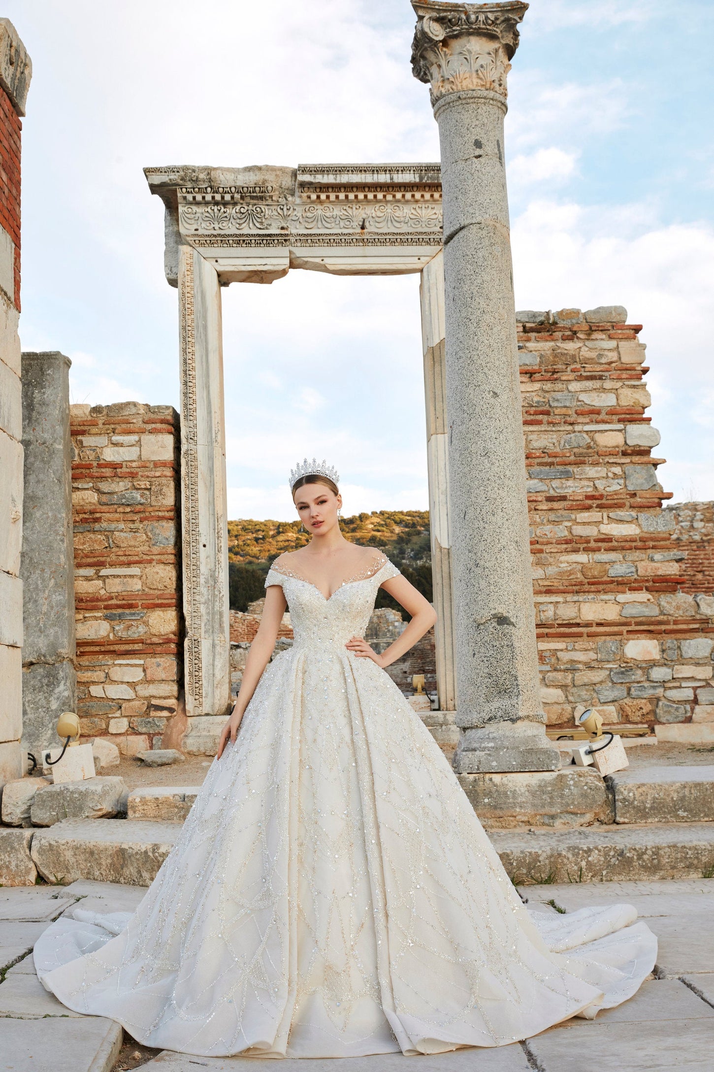 Artistry in Ivory: Off-the-Shoulder Bridal Ensemble with Timeless Charm