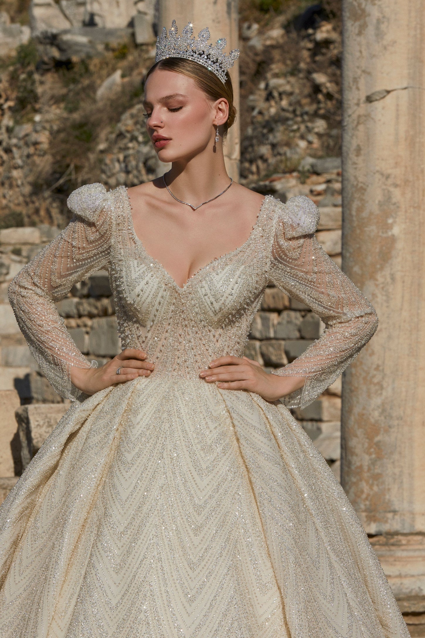 Gilded Dreams: Cream Wedding Dress with Shimmering Gold Accents
