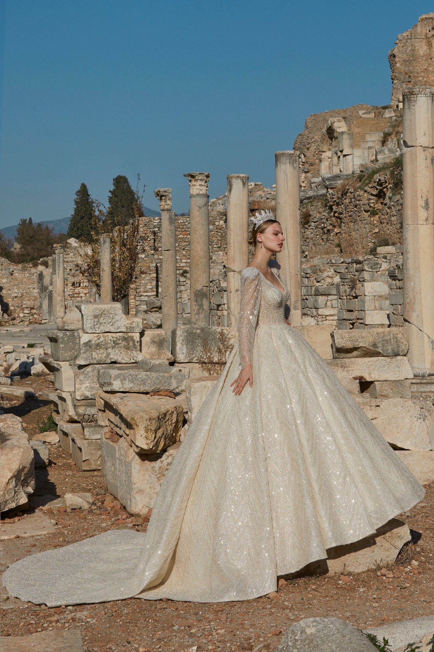Gilded Dreams: Cream Wedding Dress with Shimmering Gold Accents