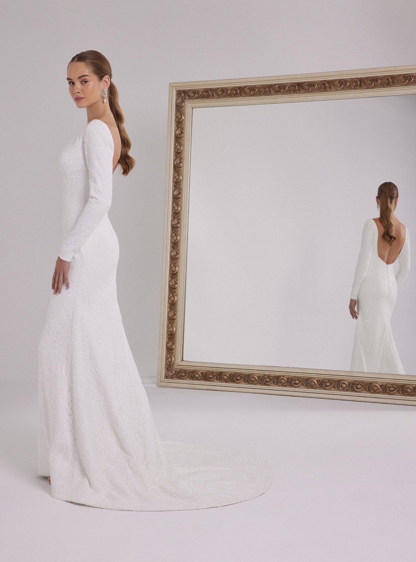 Long Sleeve Mermaid Wedding Dress with a Deep Back Decollete