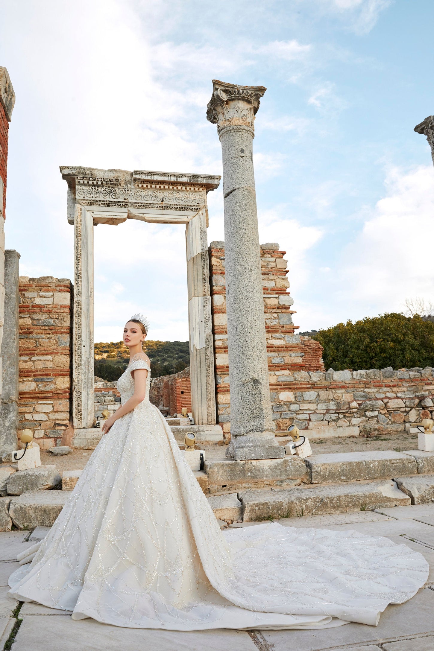 Artistry in Ivory: Off-the-Shoulder Bridal Ensemble with Timeless Charm