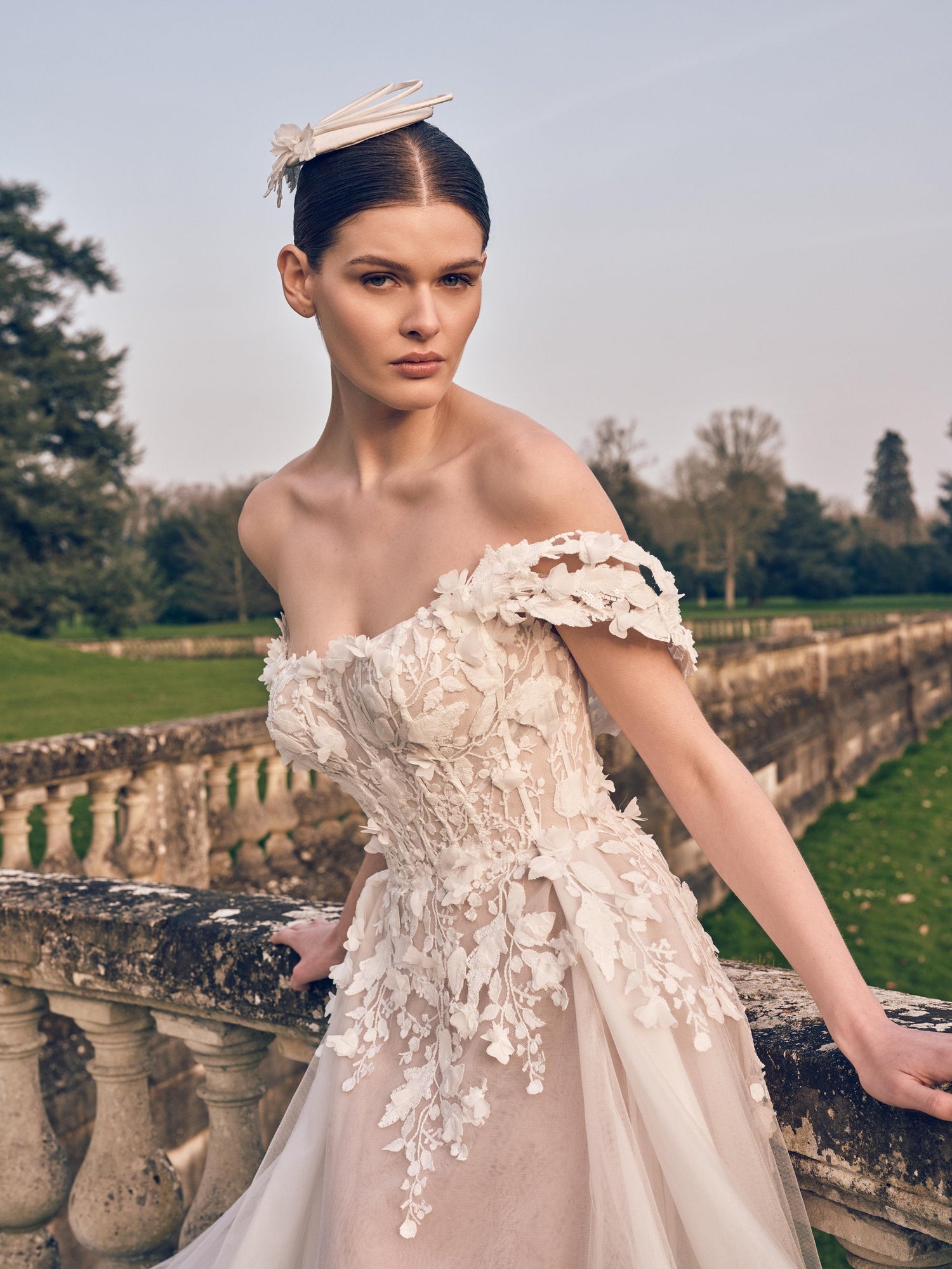 Off-shoulder A-line wedding dress with 3D floral appliqués and long flowing train – Imperia bridal collection